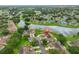 Aerial view showcases the home's location near the pond and lush surroundings at 1012 Radison Lake Ct # 59, Sun City Center, FL 33573