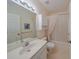 Bathroom featuring a shower-tub combo, single vanity, and updated fixtures at 1012 Radison Lake Ct # 59, Sun City Center, FL 33573