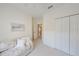 Bedroom featuring neutral carpeting, sleeper sofa, and closet at 1012 Radison Lake Ct # 59, Sun City Center, FL 33573