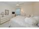 Bedroom with neutral carpeting, window, and furniture at 1012 Radison Lake Ct # 59, Sun City Center, FL 33573