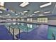 The indoor pool is well-lit with several windows and decorations, providing a relaxing swim setting at 1012 Radison Lake Ct # 59, Sun City Center, FL 33573