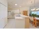 Bright kitchen showcasing modern appliances, ample counter space, and convenient access to dining area at 1012 Radison Lake Ct # 59, Sun City Center, FL 33573