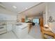Bright kitchen with white appliances, offering a seamless transition to the adjacent living room at 1012 Radison Lake Ct # 59, Sun City Center, FL 33573