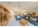Bright and airy living area with comfortable seating, entertainment center and views of dining area at 1012 Radison Lake Ct # 59, Sun City Center, FL 33573