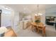 Open layout with dining area, chandelier lighting and easy access to the fully-equipped kitchen at 1012 Radison Lake Ct # 59, Sun City Center, FL 33573