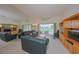 Relaxing living room with comfortable leather seating, entertainment center and mirrored wall at 1012 Radison Lake Ct # 59, Sun City Center, FL 33573