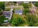 Aerial view of house with a gray roof and a large backyard at 109 Magnolia Ave, Seffner, FL 33584