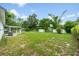 Spacious backyard featuring lush green grass at 109 Magnolia Ave, Seffner, FL 33584