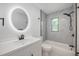 Modern bathroom featuring a sleek vanity with a black faucet and a tiled shower/tub combo at 109 Magnolia Ave, Seffner, FL 33584