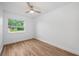 Bright bedroom with wood-look floors and neutral walls is ready for personalization at 109 Magnolia Ave, Seffner, FL 33584