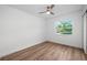 Bright bedroom with hardwood flooring, fan, and natural light at 109 Magnolia Ave, Seffner, FL 33584
