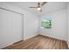 Clean bedroom with a closet, neutral walls, and wood-look floors offers a serene retreat at 109 Magnolia Ave, Seffner, FL 33584