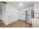 Bright kitchen features modern stainless steel appliances and hardwood flooring at 109 Magnolia Ave, Seffner, FL 33584