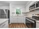 Bright kitchen featuring new appliances and stone countertops at 109 Magnolia Ave, Seffner, FL 33584