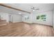 Inviting living room with wood-look floors, great natural light, and an open layout at 109 Magnolia Ave, Seffner, FL 33584