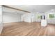 Spacious living area open to the kitchen with an island, with wood-look flooring at 109 Magnolia Ave, Seffner, FL 33584