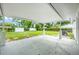 Covered patio overlooking expansive backyard at 109 Magnolia Ave, Seffner, FL 33584