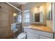 This bathroom features a tiled shower with glass doors and a vanity with granite counters at 117 Connie Ave, Tampa, FL 33613