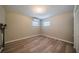 An additional bedroom featuring wood floors and neutral paint at 117 Connie Ave, Tampa, FL 33613