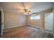 Bedroom featuring wood floors, a ceiling fan, and a window for natural light at 117 Connie Ave, Tampa, FL 33613