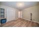 Additional bedroom with wood floors, neutral paint and large closet at 117 Connie Ave, Tampa, FL 33613