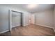 This is a bedroom with wood floors and a closet at 117 Connie Ave, Tampa, FL 33613