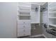 Walk-in closet featuring custom shelving, drawers, and ample hanging space for organization at 117 Connie Ave, Tampa, FL 33613