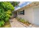 Charming home showcasing a stone facade, beautiful landscaping, and a welcoming walkway at 117 Connie Ave, Tampa, FL 33613