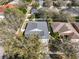 Overhead view of a single-Gathering home featuring a well-maintained yard, mature trees, and a private driveway at 11806 Holly Crest Ln, Riverview, FL 33569