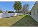 Inviting backyard with a well-manicured lawn, providing a serene and private outdoor retreat at 11806 Holly Crest Ln, Riverview, FL 33569