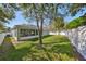 Private backyard with a large grassy area, perfect for outdoor activities and relaxation at 11806 Holly Crest Ln, Riverview, FL 33569