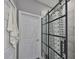 Modern bathroom with a sleek glass shower door and coordinating white tile at 11806 Holly Crest Ln, Riverview, FL 33569
