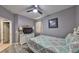 Bedroom with a ceiling fan and wood-look flooring offers natural light at 11806 Holly Crest Ln, Riverview, FL 33569
