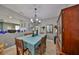 Formal dining room showcases tile floors, chandelier, and ample space for entertaining at 11806 Holly Crest Ln, Riverview, FL 33569