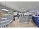 Bright kitchen with white cabinets, stainless steel appliances, and an adjacent dining area at 11806 Holly Crest Ln, Riverview, FL 33569