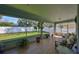 Relaxing screened-in lanai with tile flooring, comfortable seating, and a view of the lush backyard at 11806 Holly Crest Ln, Riverview, FL 33569