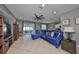 Open-concept living space featuring tile flooring, neutral decor, and access to the outdoor patio at 11806 Holly Crest Ln, Riverview, FL 33569