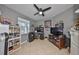 Bright home office features tile flooring, a ceiling fan, and great natural light at 11806 Holly Crest Ln, Riverview, FL 33569