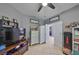 Office with tile flooring and a ceiling fan includes an entertainment center at 11806 Holly Crest Ln, Riverview, FL 33569