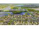 Extensive aerial view showcasing a community surrounded by multiple lakes and lush landscapes at 11837 Thicket Wood Dr, Riverview, FL 33579