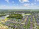 Stunning aerial view featuring the community's tranquil lakes and lush greenery, creating a serene environment at 11837 Thicket Wood Dr, Riverview, FL 33579