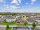 Aerial view showcasing homes with landscaped yards in a Gathering-friendly neighborhood at 11837 Thicket Wood Dr, Riverview, FL 33579