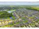 Expansive aerial view showcasing the community's beautiful lakes, green spaces, and lush vegetation at 11837 Thicket Wood Dr, Riverview, FL 33579