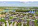 Lovely aerial view of a residential community with a lake and plentiful greenery at 11837 Thicket Wood Dr, Riverview, FL 33579