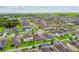 Expansive aerial view of a residential community featuring well-maintained homes and lush greenery at 11837 Thicket Wood Dr, Riverview, FL 33579
