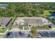 Aerial view of community clubhouse with pool, lounge chairs, and parking at 11837 Thicket Wood Dr, Riverview, FL 33579