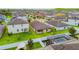 Residential aerial view of backyard with pool, fire pit, and covered gazebo seating area at 11837 Thicket Wood Dr, Riverview, FL 33579