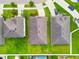 A high-angle aerial view shows neatly arranged homes with well-maintained roofs and green lawns at 11837 Thicket Wood Dr, Riverview, FL 33579