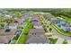 An aerial community shot with well-maintained homes and a scenic lake in the background at 11837 Thicket Wood Dr, Riverview, FL 33579