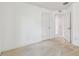 Bedroom with plush carpet, white trim and doors, and access to additional rooms at 11837 Thicket Wood Dr, Riverview, FL 33579